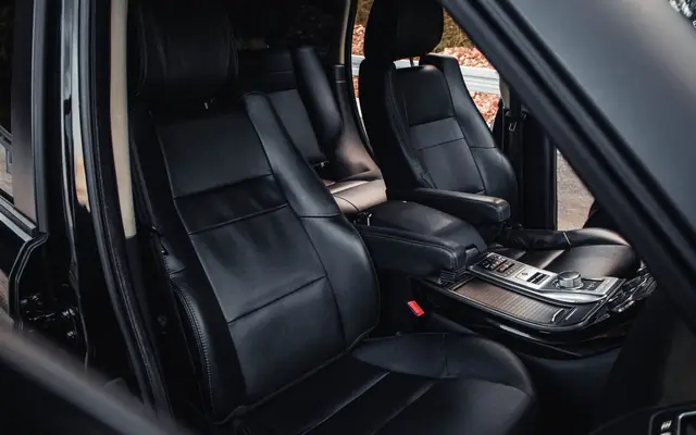 Explore a high-end car interior with elegant black leather seats, showcasing luxury and comfort.